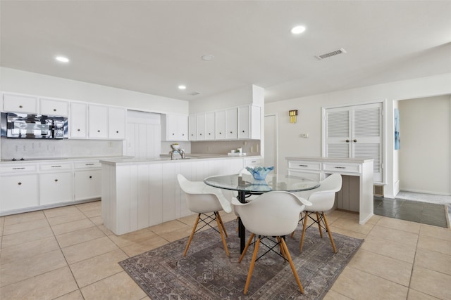 tiled dining area with sink