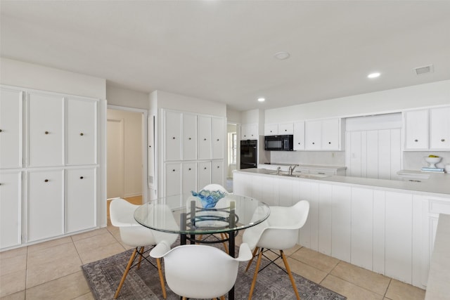 dining area with light tile patterned floors