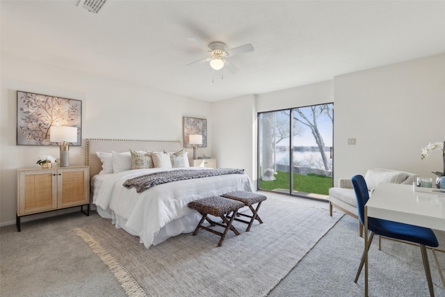 bedroom with ceiling fan, light colored carpet, and access to outside