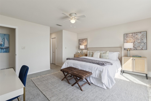 carpeted bedroom with a closet and ceiling fan