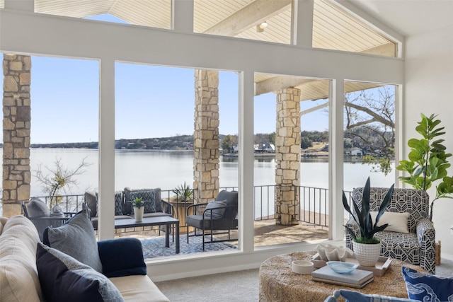 sunroom / solarium with a water view and a wealth of natural light