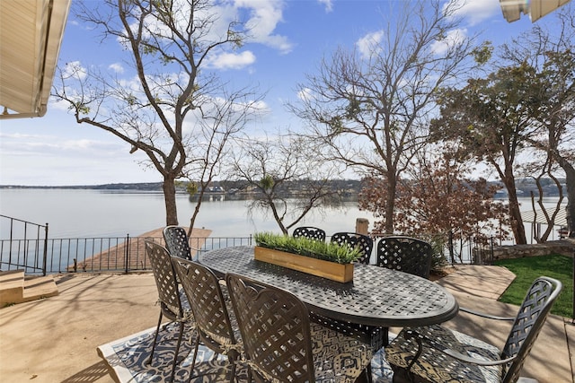 view of patio with a water view