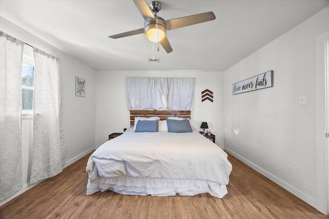 bedroom featuring ceiling fan and wood-type flooring