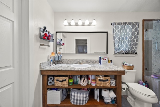 bathroom featuring toilet and vanity