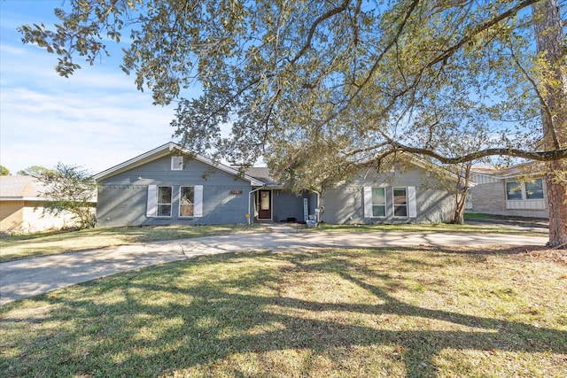 ranch-style house with a front lawn