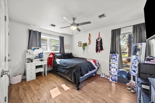 bedroom featuring light wood-type flooring and ceiling fan