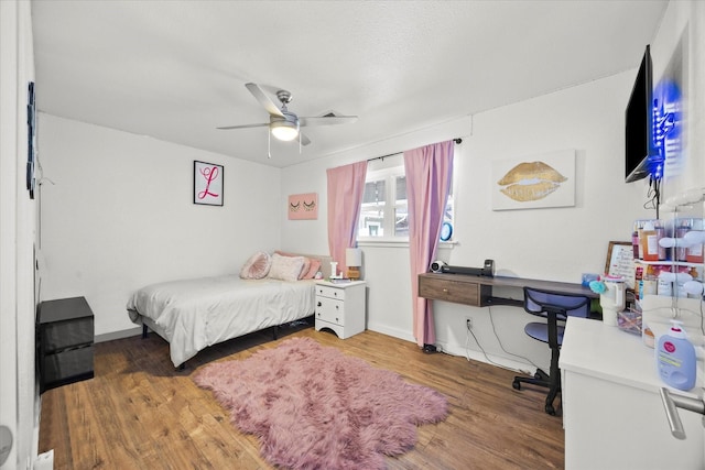 bedroom featuring ceiling fan and wood-type flooring