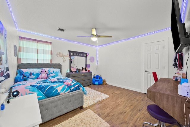 bedroom featuring ceiling fan and light hardwood / wood-style flooring