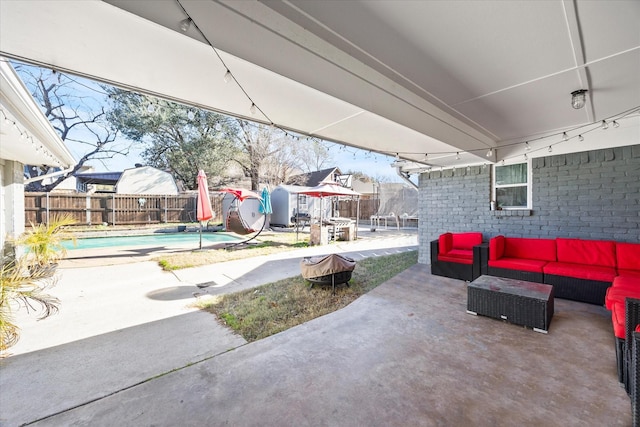 view of patio with an outdoor hangout area and a fenced in pool