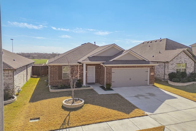 view of front of property with a front yard and a garage