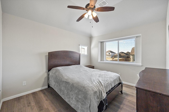 bedroom featuring ceiling fan and dark hardwood / wood-style flooring