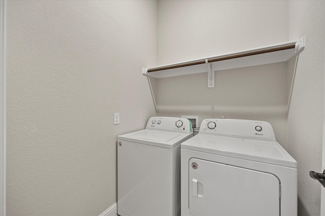 laundry area with independent washer and dryer