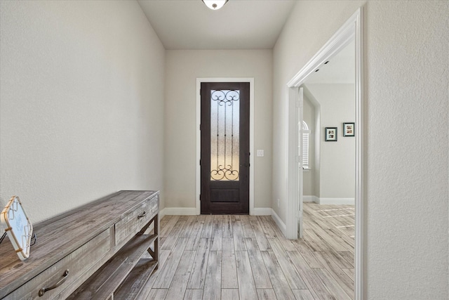 entryway with light hardwood / wood-style floors