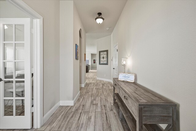 home office with baseboards, ceiling fan, and lofted ceiling
