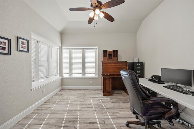 office with baseboards, a ceiling fan, and lofted ceiling