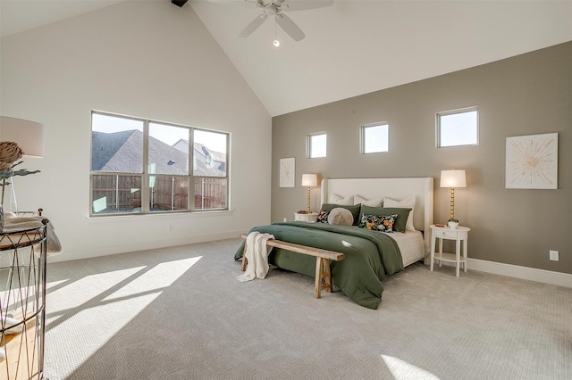 carpeted bedroom featuring ceiling fan and high vaulted ceiling