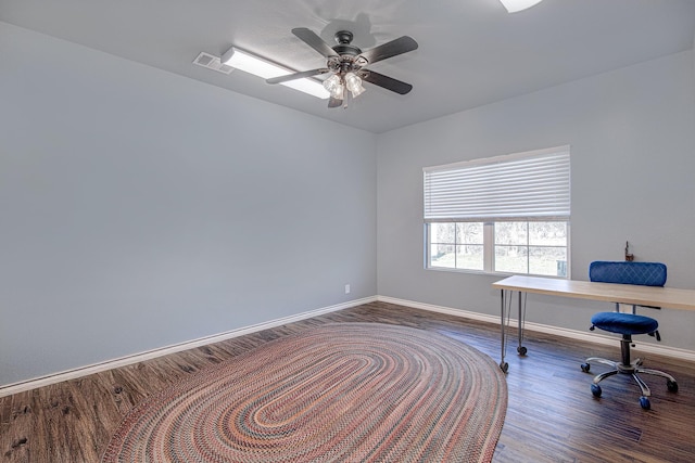 home office featuring dark hardwood / wood-style flooring and ceiling fan