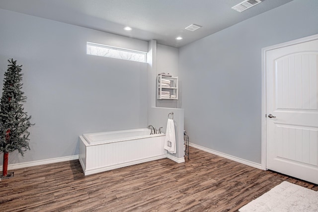 12642 Kollmeyer Way, Fort Worth, TX 76126 - bathroom with wood finished floors, a garden tub, baseboards, and recessed lighting
