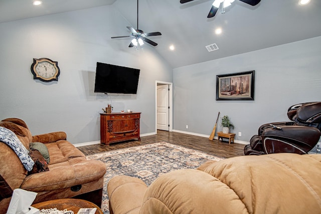 living room with dark hardwood / wood-style flooring and high vaulted ceiling