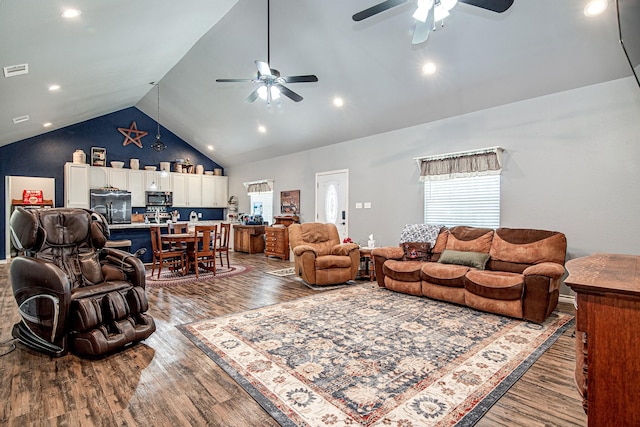 living room featuring high vaulted ceiling, wood-type flooring, and ceiling fan