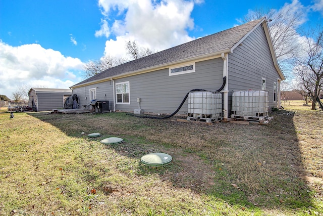 back of house with a yard