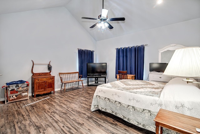 bedroom with vaulted ceiling, ceiling fan, and hardwood / wood-style floors