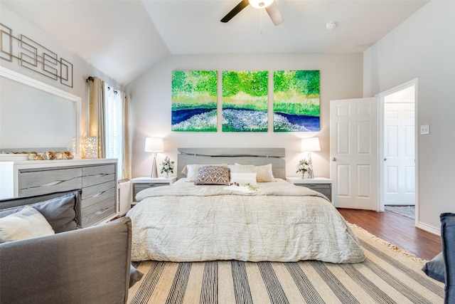 bedroom with baseboards, a ceiling fan, vaulted ceiling, and wood finished floors