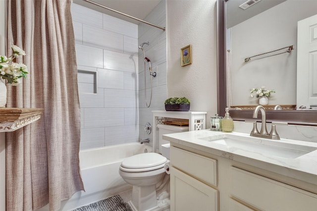 full bath featuring toilet, visible vents, shower / bath combo with shower curtain, and vanity