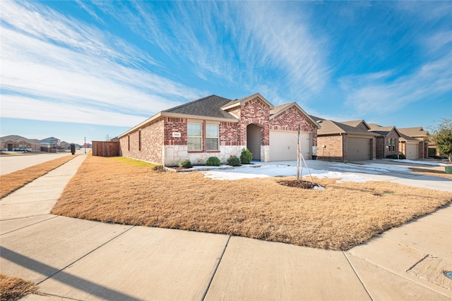 ranch-style home featuring a garage