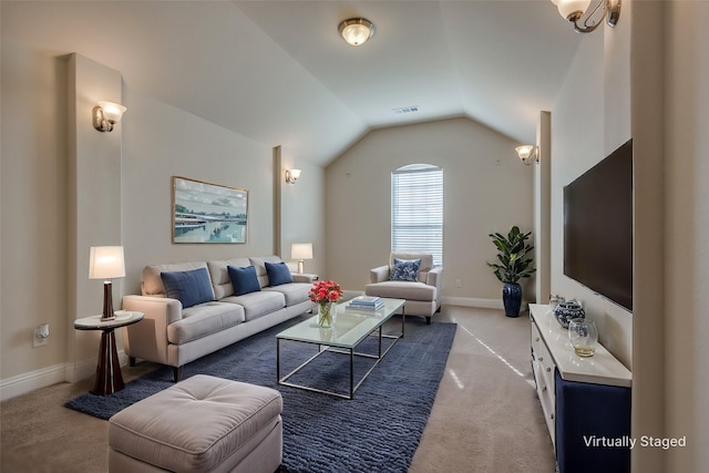 living room featuring vaulted ceiling and light colored carpet