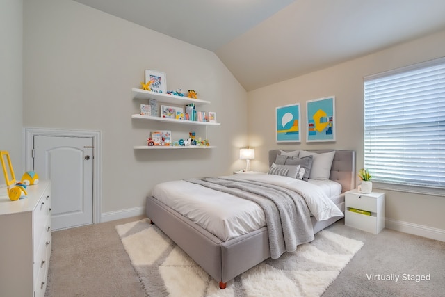 carpeted bedroom featuring vaulted ceiling