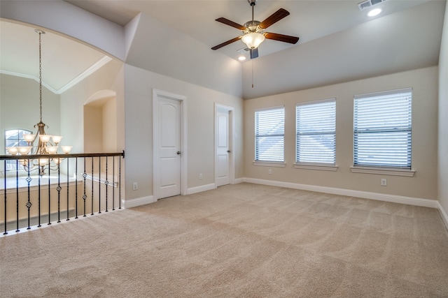 unfurnished room featuring carpet, ceiling fan with notable chandelier, ornamental molding, and high vaulted ceiling