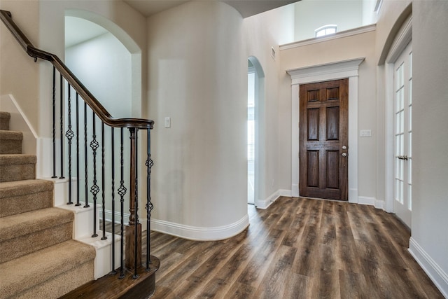 foyer with dark wood-type flooring