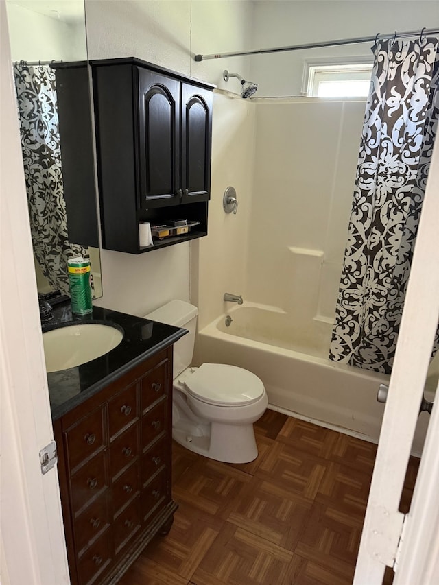 full bathroom with toilet, vanity, parquet floors, and shower / tub combo