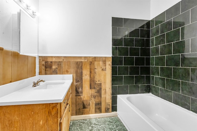 bathroom with vanity, wood walls, and tile patterned flooring