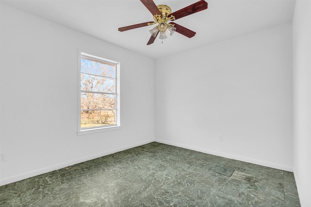 unfurnished room with ceiling fan