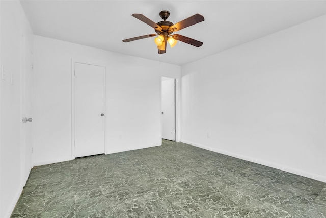 spare room with ceiling fan