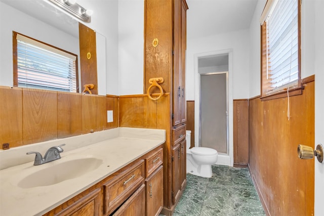 bathroom featuring an enclosed shower, vanity, toilet, and wooden walls