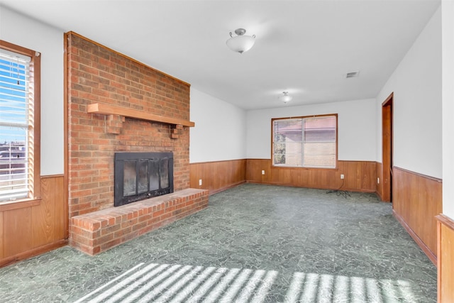 unfurnished living room featuring a fireplace