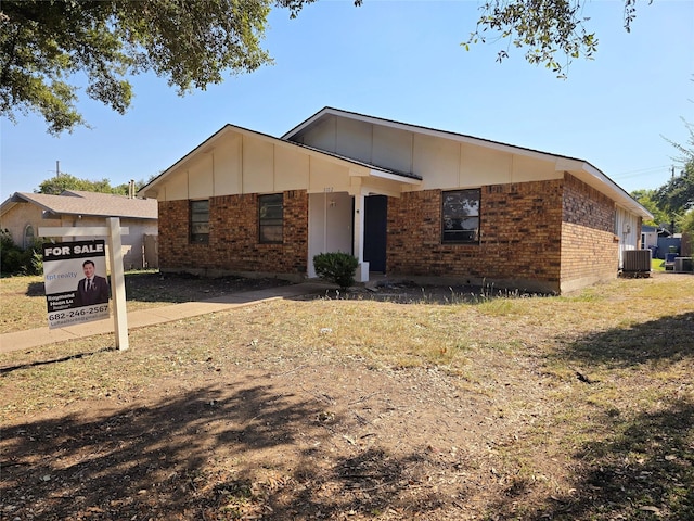 ranch-style house featuring cooling unit