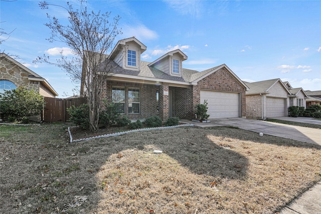 view of front of property with a front yard and a garage