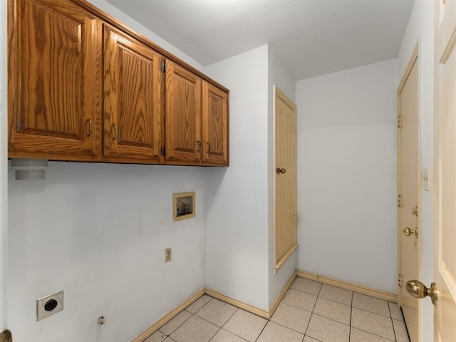 washroom featuring hookup for a washing machine, cabinets, and hookup for an electric dryer