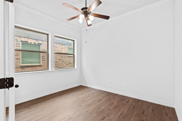 spare room with ceiling fan, ornamental molding, and hardwood / wood-style flooring