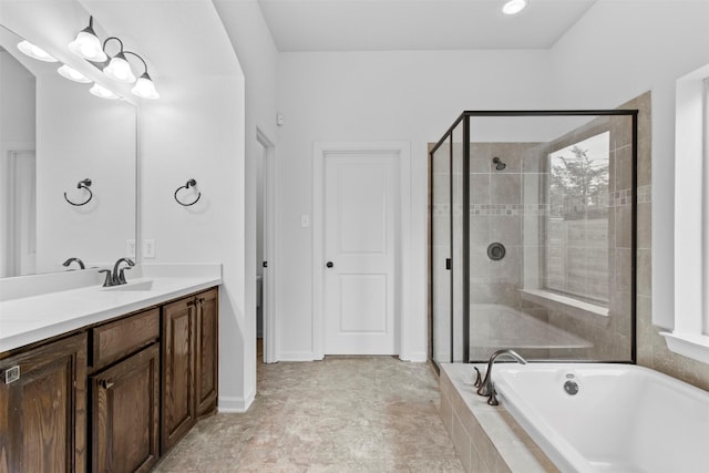 bathroom featuring vanity and separate shower and tub