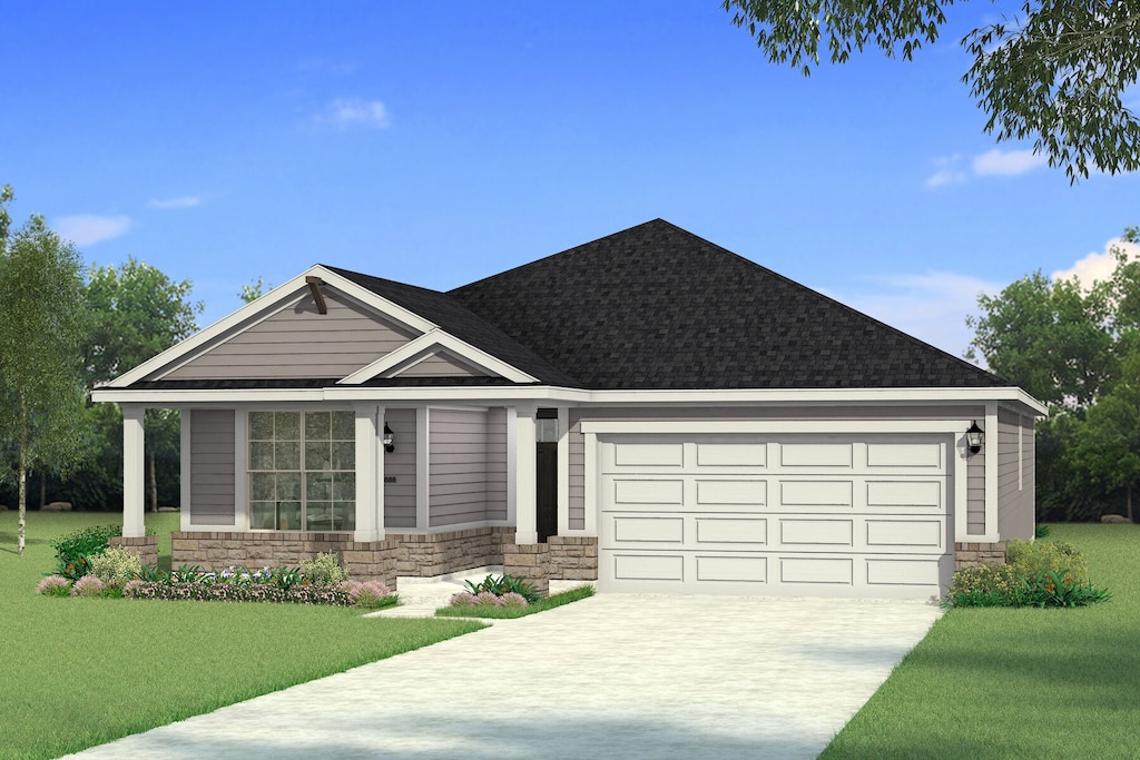 view of front of home featuring a front yard and a garage