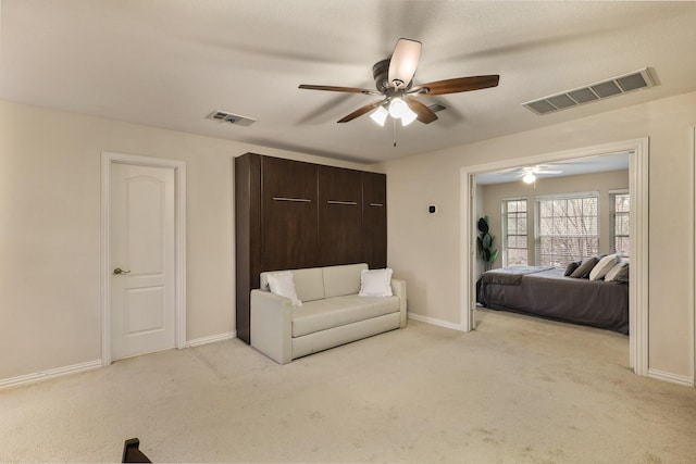 carpeted bedroom with ceiling fan