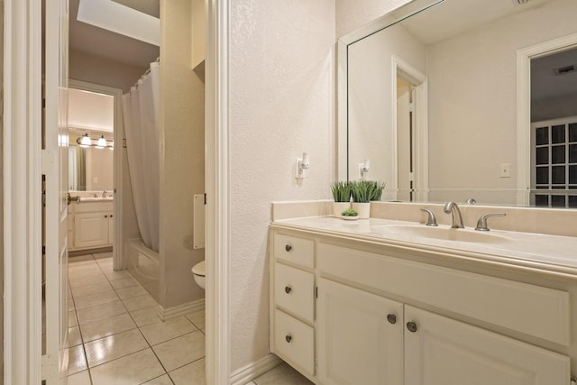 full bathroom with tile patterned floors, toilet, shower / tub combo, and vanity