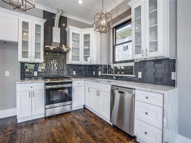 kitchen with white cabinets, light stone countertops, sink, and stainless steel appliances