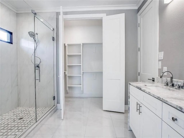 bathroom with an enclosed shower, vanity, and crown molding