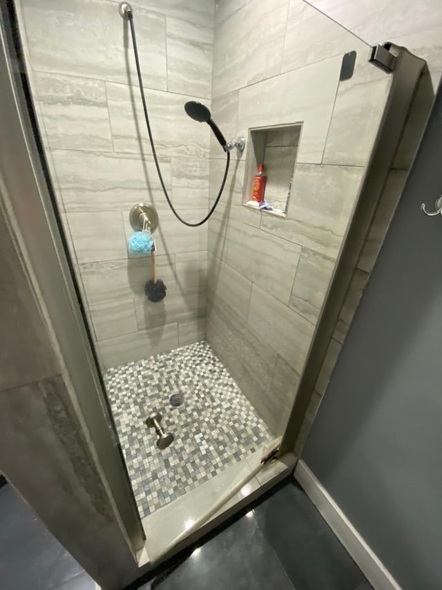 bathroom with a tile shower